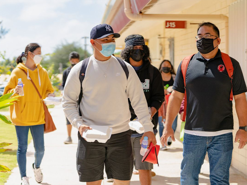 Northern Marianas College Criminal Justice Department Chair Clement Bermudes, right, talks with a student on the first day of the Spring 2022 semester. NMC started its spring semester on January 18, 2022.